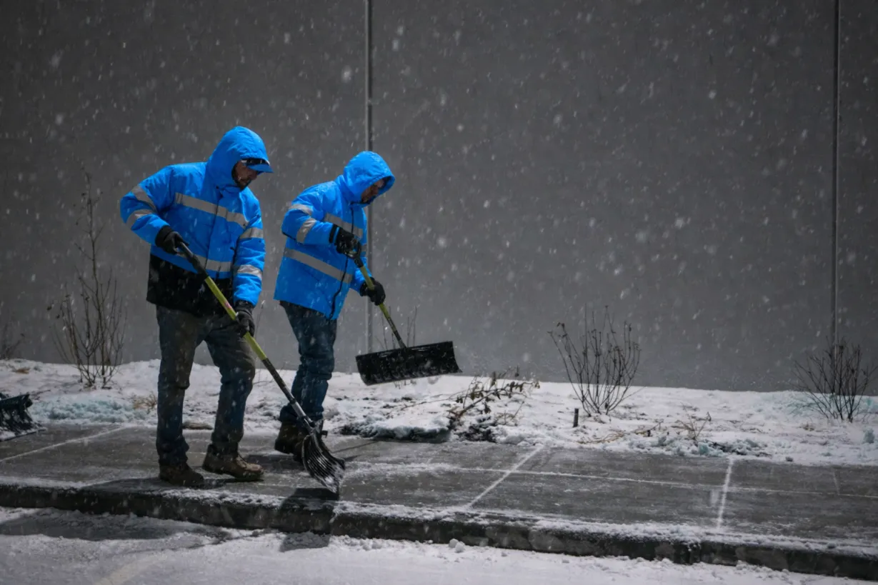 Cleanly shoveled front steps showing bare concrete for maximum safety