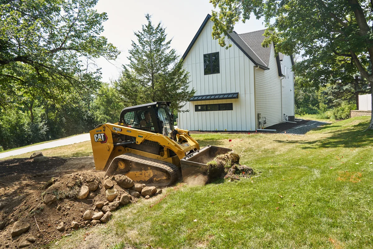 Clearing brush, stumps, and rock from a Long Lake property